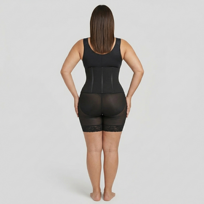 Person wearing a black shapewear garment on a plain background